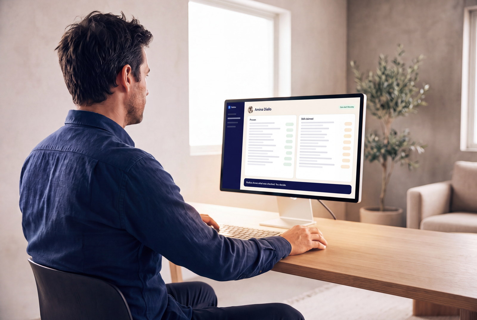 A recruiter at a desk reading a right-to-work check